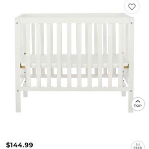 Mini crib by Dream on Me. Mattress not included. Mint condition